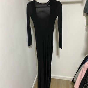 Lightweight, midnight black mermaid gown with open back